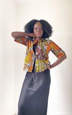 African wax fabric shirt, made for easy and comfortable fit. Perfect for multi-functional styling. From formal to casual; styled with heels or sneakers, the Circ Crisp will be the statement piece of the outfit. 60 cm long Model is a size 8, wearing a size Small (8-10) Material. 100% Cotton Care - Hand wash or wash under 30. Iron on low heat Made in Scotland Casual Printed Office Shirt, Orange Cotton Blouse For Work, Trendy Orange Cotton Blouse, Casual Office Shirt With Graphic Print, Printed Cotton Shirt For Work, Orange Cotton Button-up Blouse, Cotton Button-up Blouse With Graphic Print, Orange Button-up Cotton Blouse, Cotton Relaxed Fit Shirt For Office