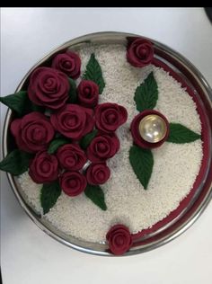 there is a cake with flowers on the top and a candle in the middle for decoration