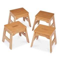 three wooden step stools sitting next to each other