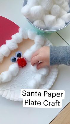 santa paper plate craft for kids to make with yarn and cotton balls on the table