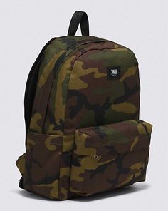 The Old Skool Backpack is a favorite for good reason. This classic backpack features an all-purpose, two pocket design with an organizer in the front, a slip-in interior pocket, and laptop sleeve that fits most 15'' laptops. Bold camoflauge print along with heritage details like the woven logo label bring an touch to this iconic design in a way only Vans can do. Our team has set ambitious sustainability goals. Big or small, all of our efforts add up to positive change. To earn the Checkerboard globe logo, at least 30% of the product must be made up of one or a combination of recycled, renewable, and/or regenerative materials. Shell: 100% Recycled Polyester fabric Lining: 100% Recycled Polyester fabric Front pocket with organizer Sleeve that fits most 15'' laptops (laptop not included) Ergo Globe Logo, Recycled Polyester Fabric, Logo Label, Iconic Design, Classic Backpack, Positive Change, Old Skool, Laptop Sleeve, Pocket Design