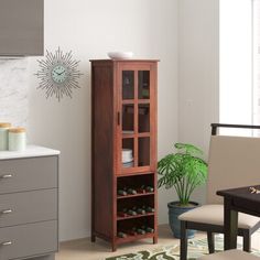 a living room with furniture and decor on the walls, including a bookcase filled with books