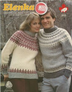 a man and woman in sweaters standing next to each other with their arms around each other