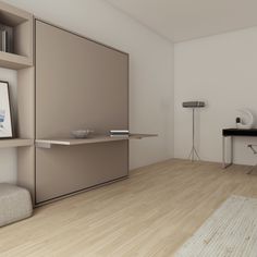 an empty room with a desk and shelves