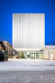 the exterior of a modern building at night