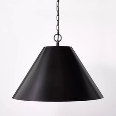 a black pendant light hanging from a chain