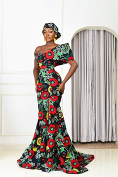 Ayana is a Swahili name that means beautiful flower. A name fitting for this absolutely gorgeous African print mermaid dress. This vibrant, bold and beautiful dress is ready to take center stage at your next occasion. The cut of this dress accentuates the body to a figure elevating mermaid silhouette before flaring out to a floor-length for that dramatic effect. Off-the-shoulder neckline. Dramatic deconstructed sleeves for that statement look. Zipper at the back for easy wear. Mermaid silhouette African Traditional Dresses Wedding, Chitenge Dresses Classy, Ugandan Wedding, Traditional Dress Ideas, African Prom Dresses Ankara, Chitenge Dresses, African Formal Dress, Nigerian Clothing, Bubu Gowns