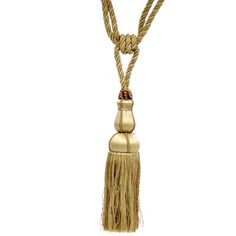 a gold necklace with tassels hanging from it's sides and two beads on the end