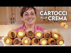 a woman holding a tray full of pastries in front of her face with the words cartocoi alla crema on it