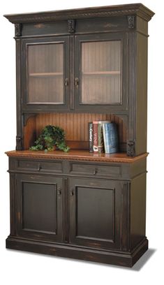 an old fashioned china cabinet with books and plants on it's top, isolated against a white background