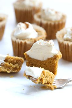 cupcakes with white frosting and a bite taken out