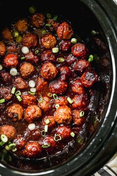 crock pot filled with meatballs and onions