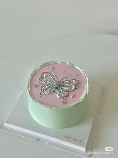 there is a cake with a butterfly on it