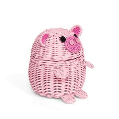 a pink pig shaped basket sitting on top of a white floor