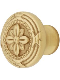 an antique style door knob with a flower design on the front and back of it