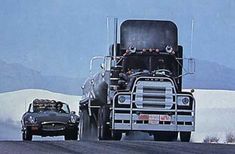 two cars driving down the road next to a large truck