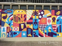 a large colorful mural on the side of a building