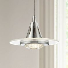 a light fixture hanging from the ceiling in a room