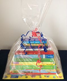 a plastic bag filled with books on top of a table