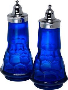 two blue glass salt and pepper shakers