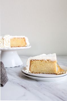 a slice of cake sitting on top of a white plate next to another piece of cake