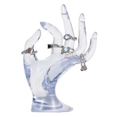 a glass hand with rings on it's fingers