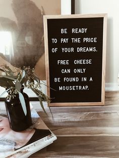 a sign that says be ready to pay the price of your dreams free cheese can only be found in a mousetrap