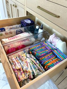 an open drawer filled with lots of crafting supplies