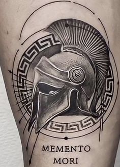 a man's leg with a spartan helmet on it