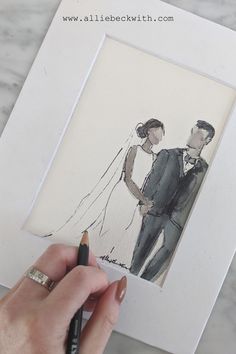 a drawing of a bride and groom holding hands in front of a marble table top