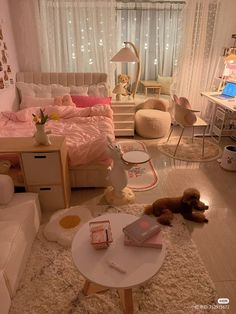 a bedroom with white furniture and pink bedding