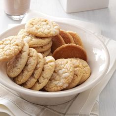 a white bowl filled with cookies on top of a table