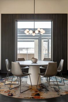 A dining room with a vertical wood trim accent wall, adding depth to the space. Rooms With Accent Walls, Wood Trim Accent Wall, Trim Accent Wall, Elegant Dining Rooms