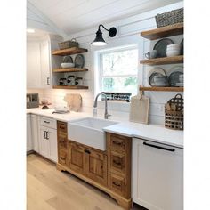 a kitchen with wooden cabinets and white counter tops is featured in the magazine lezzir