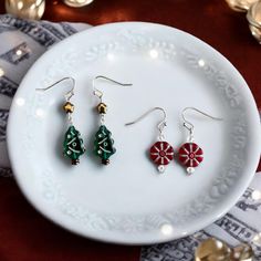 Bring the spirit of the season to your style with our enchanting Peppermint Tree dangle earring set! ✨ These vibrant and cheerful earrings are the perfect festive accessory that you can also mix-n-match for your holiday gatherings. Designed to sparkle and shine, they're a delightful gift for her or a special treat for yourself! 🎁Perfect for those cozy holiday parties or as a charming touch to any Christmas outfit, these earrings are sure to spread joy and holiday cheer wherever you go. Don't mi Nickel-free Drop Earrings For Holiday, Peppermint Tree, Dangle Earrings Boho, Christmas Tree Earrings, Cozy Holiday, Earring Tree, Christmas Earrings, Earrings Boho, Holiday Gathering