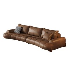 a brown leather couch with pillows on it's back and arm rests against a white background