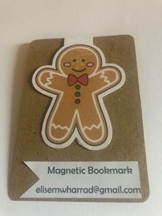 the magnet is shaped like a ginger with a bow tie