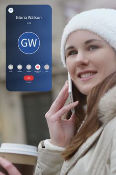 a woman talking on her cell phone while holding a cup of coffee in her hand