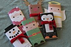 small christmas gifts wrapped in brown paper with red bows and reindeer nose decorations on them