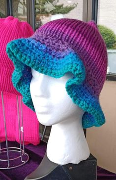 Handcrafted colorful pink purple & blue Bucket Hat  Size: Fits Teens & Adults Craftsmanship: Expertly knitted and crocheted with precision and care. Design: Colorful ombre design with a flowy brim Materials: Made with high-quality, vegan-friendly acrylic yarns. Ethos: Proudly woman-owned business, crafting with compassion and eco-conscious practices. Embrace your style with this colorful bucket hat, meticulously handcrafted for comfort and flair.  💚 visit my shop for more💚 https://www.etsy.com/shop/HandmadebyHollyween Handmade Purple Cap, Blue Knit Hat, One Size Fits Most, Hand Knitted Purple Yarn Hats, Adjustable Hand-knitted Purple Crochet Hat, Blue Knit Hat One Size Fits Most, Adjustable Hand Knitted Purple Crochet Hat, Purple Adjustable Crochet Hat, Adjustable Purple Hand Knitted Crochet Hat, Handmade Purple Hat One Size