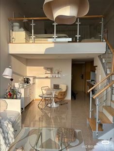 a living room filled with furniture next to a staircase