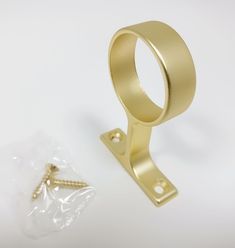 an image of a gold ring and screw