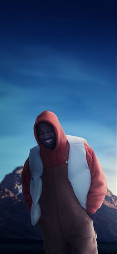 a man in an orange and white hooded jacket