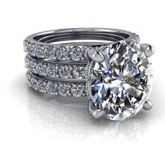 a diamond engagement ring set with two matching bands