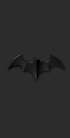 the dark knight batman logo on a black background