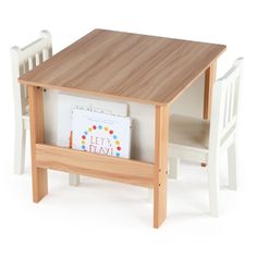 a small wooden table with two chairs and a book on it's back end