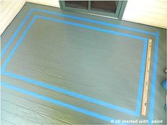 the floor is being painted and ready to be put in front of the door with blue tape