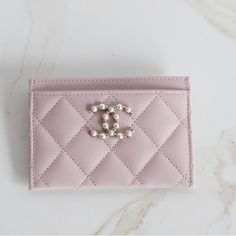 Authentic Chanel Pink Caviar Card Holder New Never Used Comes With Box, Dustbag , And Serial Card Super Rare And Absolutely Stunning! Has A Beautiful Special Pearl Cc Logo With Gold Hardware From The 21s Collection Color Is Light Pink Caviar Leather With Light Gold Hardware This Is A One Of A Kind Piece That Is Impossible To Find. Elegant Pink Rectangular Card Holder, Elegant Pouch Bag With Card Slots, Elegant Pink Leather Coin Purse, Elegant Wallets With Removable Pouch, Luxury Bags With Card Slots For Gift, Elegant Wallets With Removable Pouch For Shopping, Elegant Leather Wallet For Shopping, Elegant Pink Everyday Card Holder, Chic Rectangular Card Holder