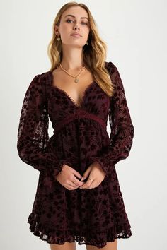 We already know your closet is full of beauties, but the Lulus Charming Favorite Burgundy Burnout Velvet Babydoll Mini Dress is definitely going to be one of your top picks! A velvet floral burnout design adorns a sheer mesh overlay (atop a matching knit liner) that shapes a lightly gathered bodice, a plunging, sweetheart-style neckline, and long sleeves with elasticized, ruffled cuffs. The high, empire waist tops a twirl-worthy skater skirt that falls to a ruffled mini hem. Delicate crochet lac Gothic Cottagecore, Goth Princess, Empire Waist Tops, Delicate Crochet, Gathered Bodice, Casual Formal Dresses, Babydoll Mini Dress, Velvet Burnout, Burnout Velvet