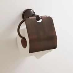 a roll of toilet paper is hanging on the wall